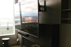A dropdown fireplace TV mount