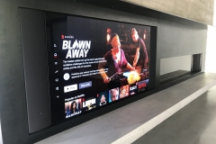 a recessed tv with side mounted speakers